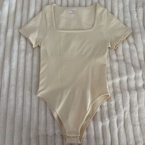 Size small OQQ body suit. Thick material never worn.